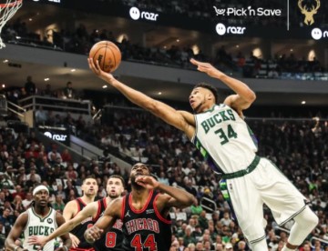 九游电子平台-季后赛首战进攻低迷哑火 冠军防守助雄鹿险度难关